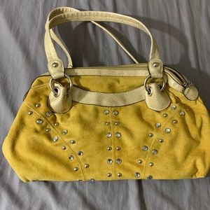 Kathy Van Zeeland yellow purse.
